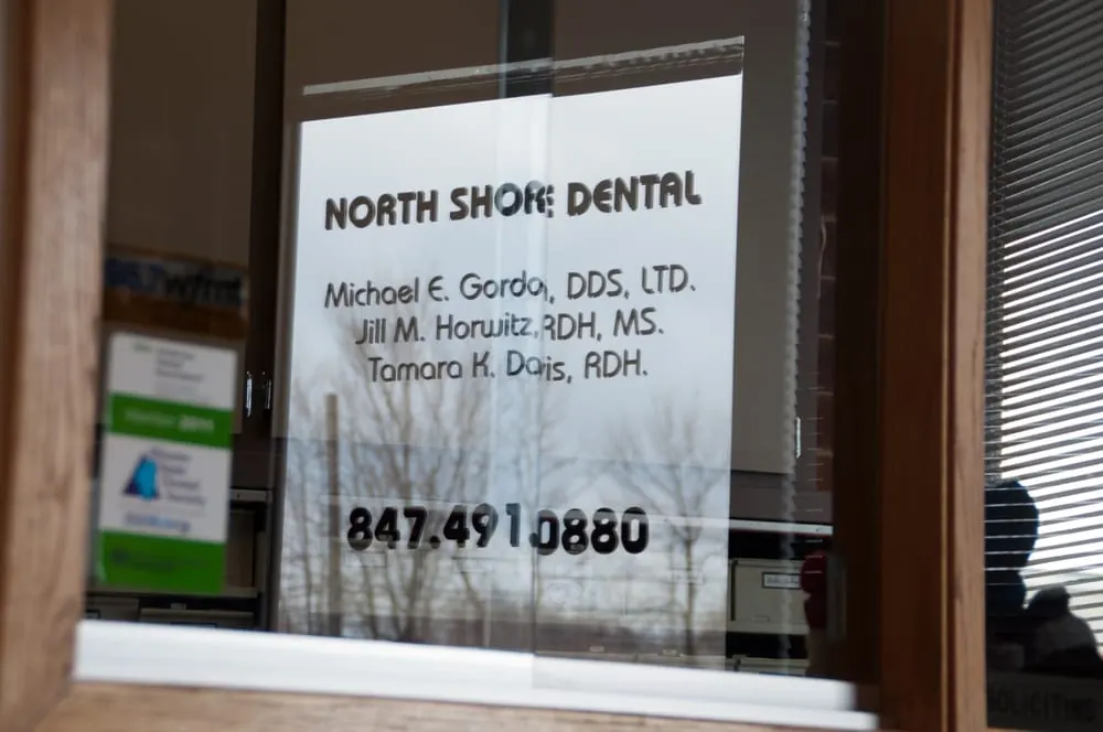 The North Shore Dental door, lettered with the names of Dr. Michael E. Gordon, Jill M. Horwitz and Tamara K. Davis.